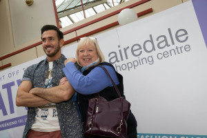 Shopper Kate Jenkins of Keighley meets model Paul Curran during the Airedale Centre fashion show
